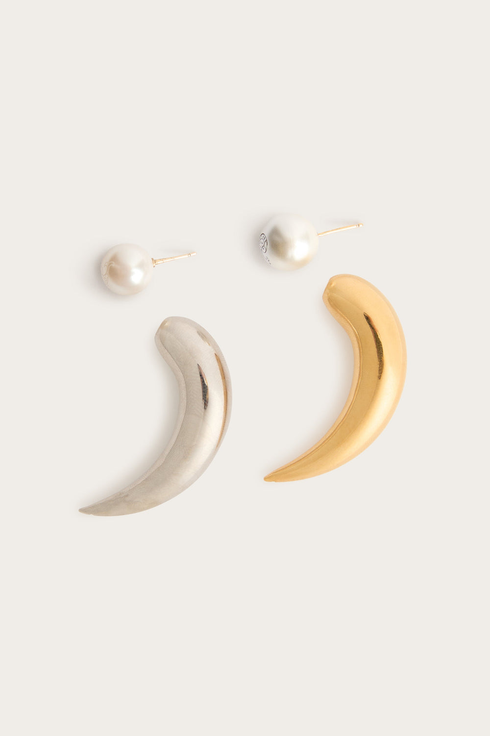Horn Earrings with Pearl
 WOMAN Pucci
