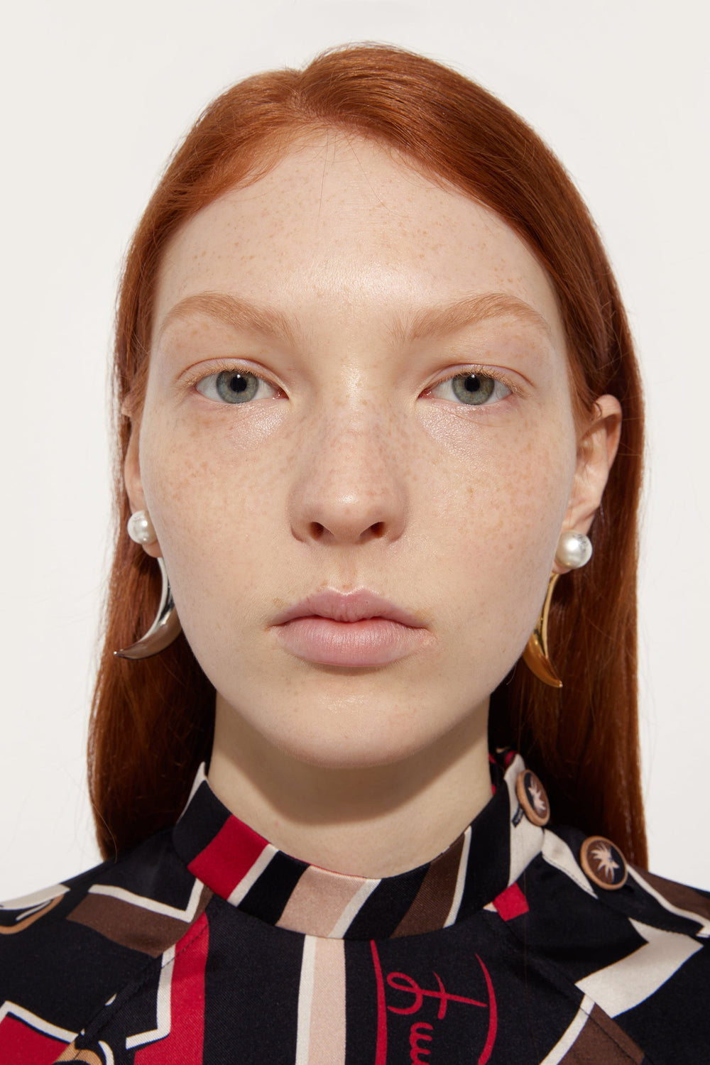 Horn Earrings with Pearl
 WOMAN Pucci