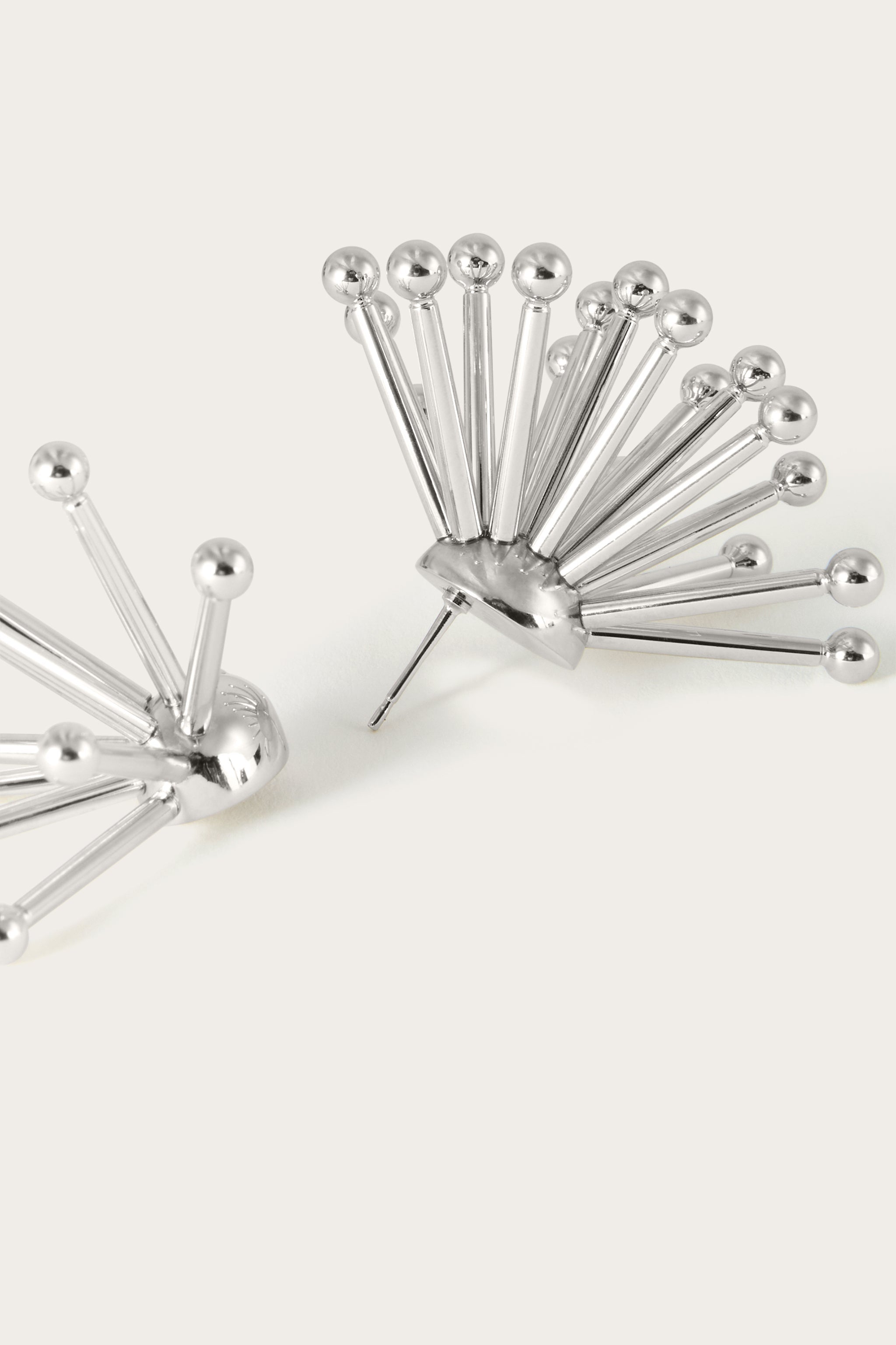 Riccio Earrings
 WOMAN Pucci